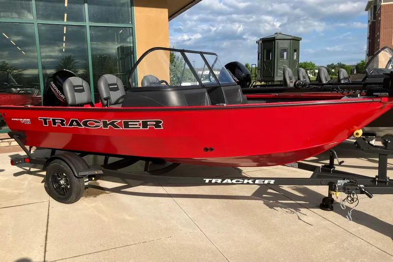 The Image of 2026 Tracker Pro Guide V-16 WT boat in vibrant red on a trailer. - 0