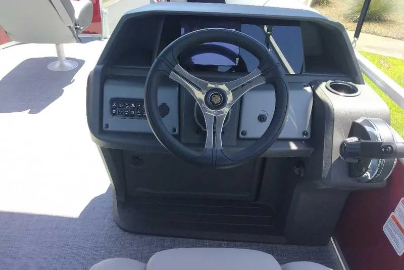 Slide: The Image of Steering console of 2026 Sun Tracker SportFish 20 DLX pontoon boat, featuring modern controls. - 7