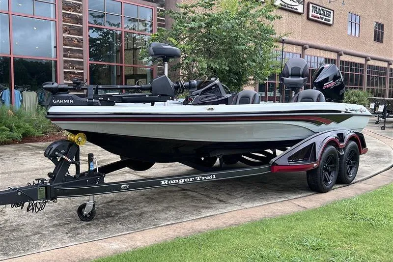 The Image of 2026 Ranger Z518 Cup-Equipped boat on trailer, parked outdoors near a building. - 0