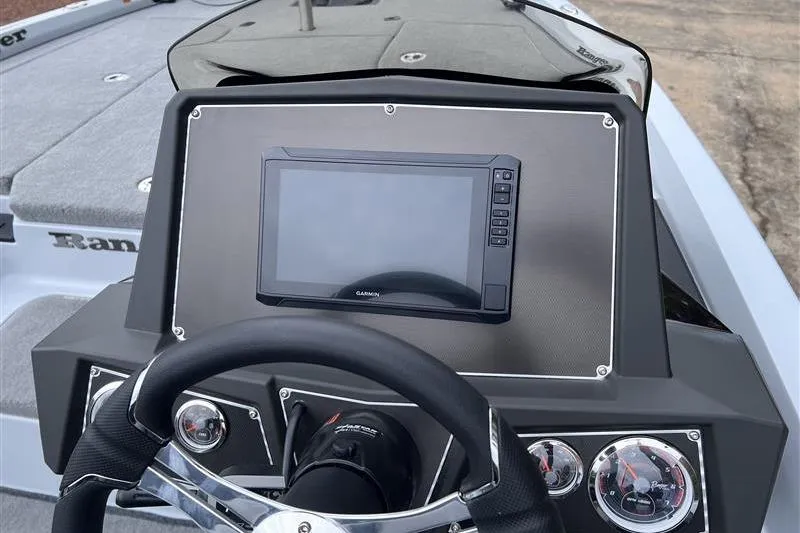 Slide: The Image of 2026 Ranger Z518 Cup-Equipped boat dashboard with Garmin display and steering wheel. - 11