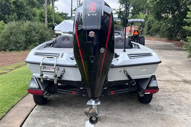 Slide: The Image of 2026 Ranger Z518 Cup-Equipped boat with powerful V8 engine, parked on driveway. - 3