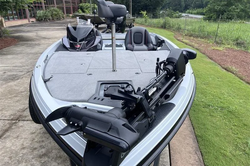 Slide: The Image of 2026 Ranger Z518 Cup-Equipped boat with advanced fishing features, parked outdoors. - 7