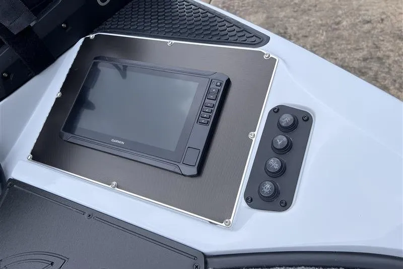 Slide: The Image of 2026 Ranger Z518 Cup-Equipped boat dashboard with Garmin display and control buttons. - 8