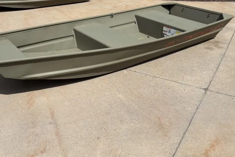 Slide: The Image of 2026 Tracker Grizzly 12 Jon boat on concrete surface, showcasing its sturdy design. - 33