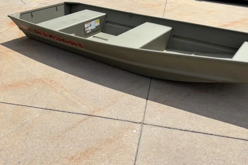 Slide: The Image of 2026 Tracker Grizzly 12 Jon boat on concrete surface, showcasing its sturdy design. - 32