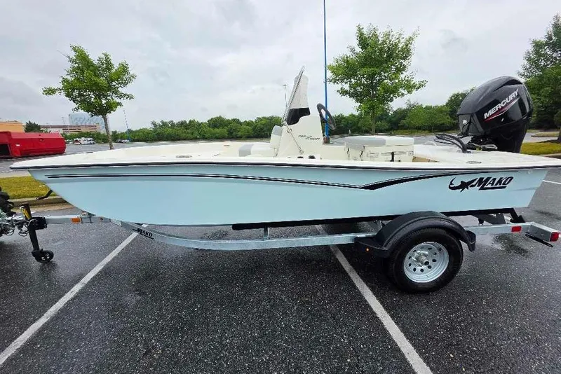 Slide: The Image of 2026 Mako Pro Skiff 15 CC boat on trailer in parking lot. - 3