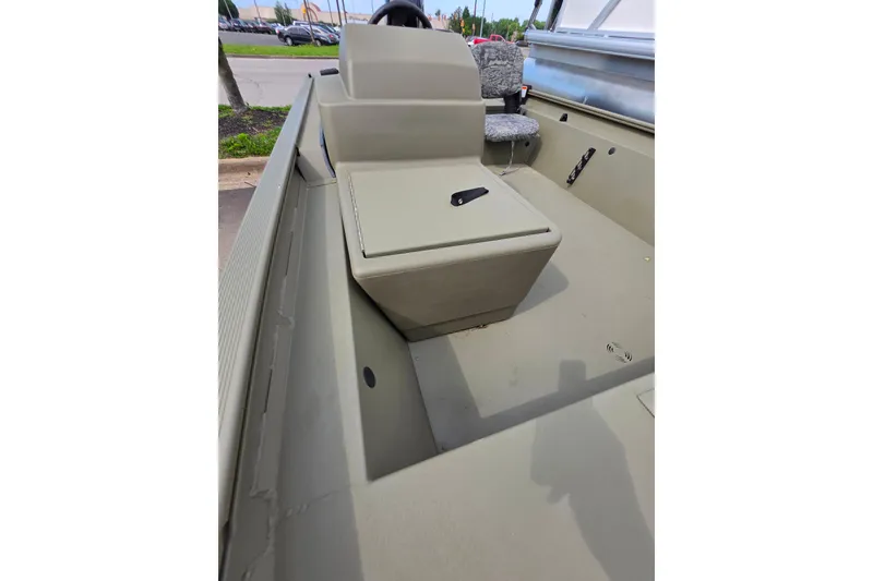 Slide: The Image of 2026 Tracker Grizzly 1754 SC boat interior with seating and steering console. - 5