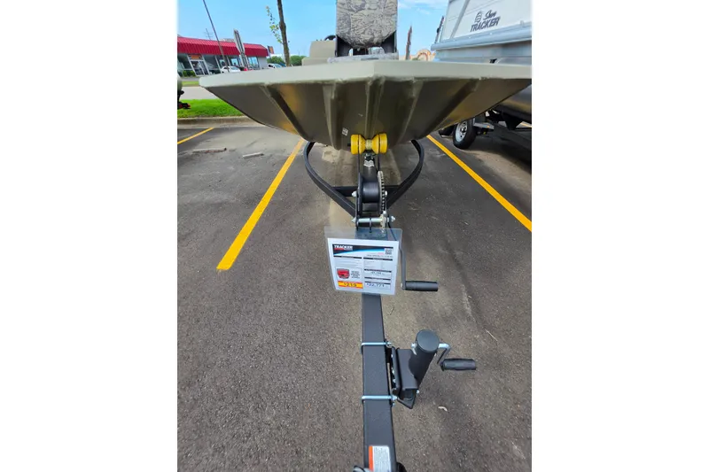 Slide: The Image of 2026 Tracker Grizzly 1754 SC boat on trailer in parking lot. - 8