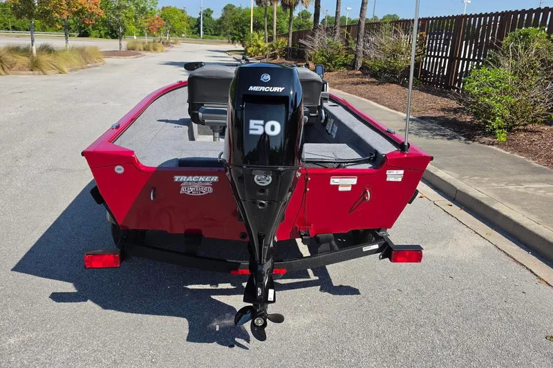 Slide: The Image of 2026 Tracker Super Guide V-16 SC boat with Mercury 50 engine, parked outdoors. - 10