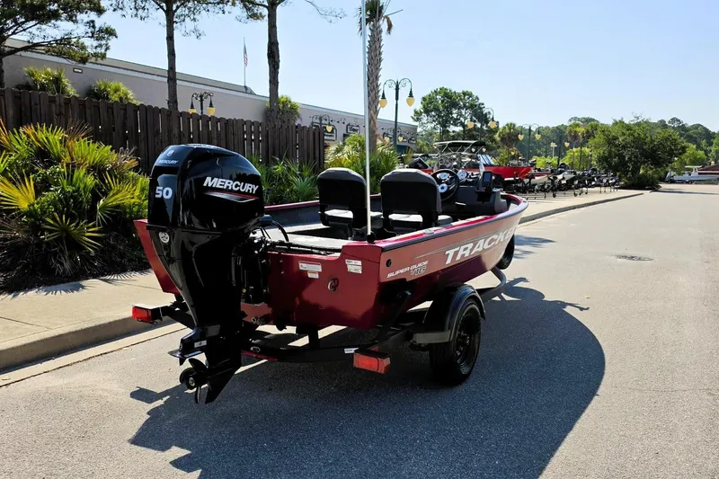 Slide: The Image of 2026 Tracker Super Guide V-16 SC boat with Mercury 50 engine on trailer. - 4