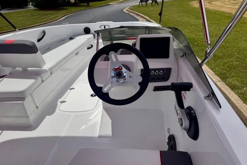 Slide: The Image of 2026 Tahoe T18 boat cockpit with steering wheel and control panel. - 9