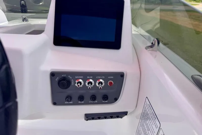 Slide: The Image of Dashboard of 2026 Tahoe T18 boat with control panel and display screen. - 8