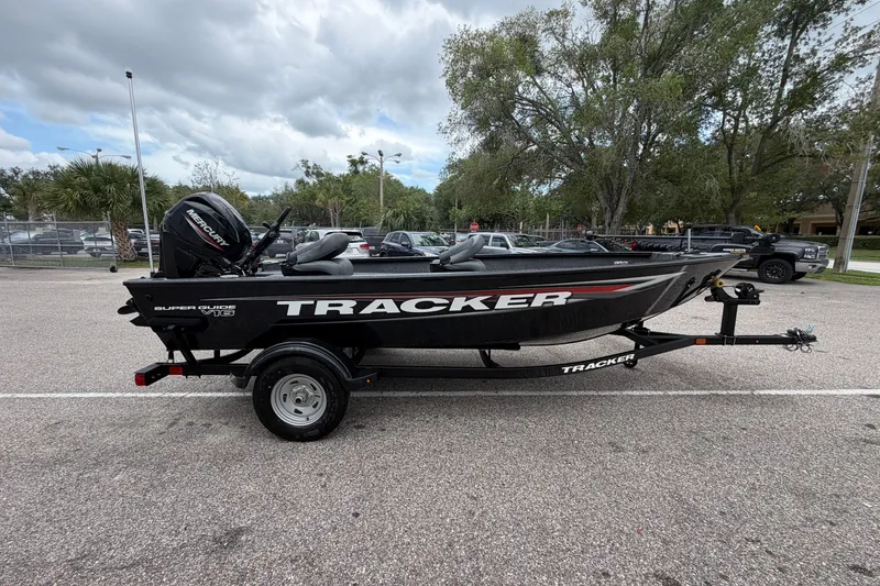 The Image of 2026 Tracker Super Guide V-16 T boat on trailer in parking lot. - 0