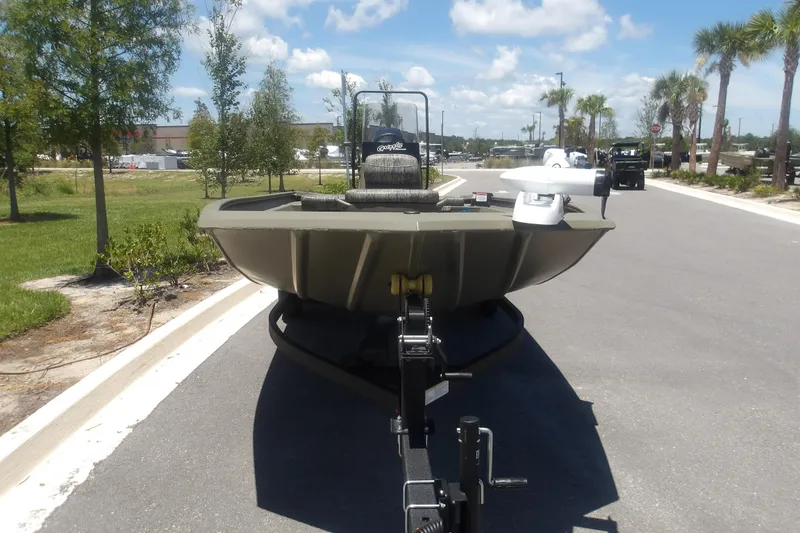 Slide: The Image of 2026 Tracker Grizzly 1860 CC boat on trailer, parked on sunny road. - 6