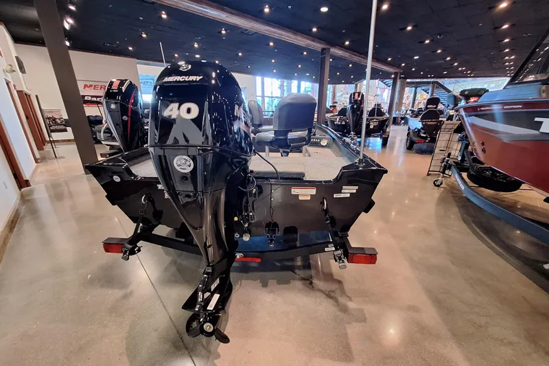 Slide: The Image of 2026 Tracker Super Guide V-16 T boat with Mercury 40 engine in showroom. - 4