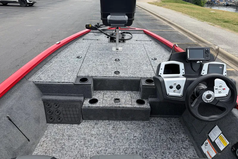 Slide: The Image of 2026 Tracker Pro Team 195 boat interior with steering wheel and control panel. - 12
