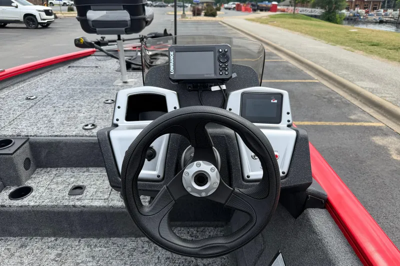 Slide: The Image of Steering console of 2026 Tracker Pro Team 195 boat with navigation equipment. - 13