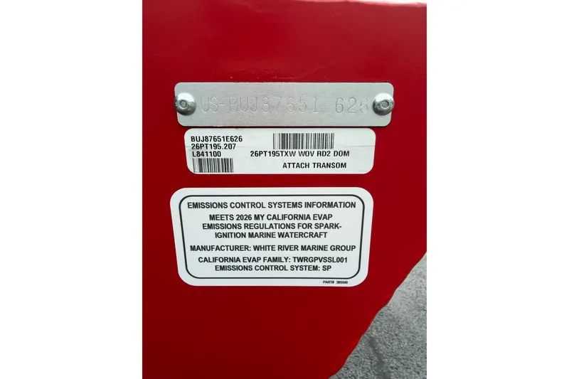 Slide: The Image of 2026 Tracker Pro Team 195 emissions control label on red surface, detailing compliance information. - 14