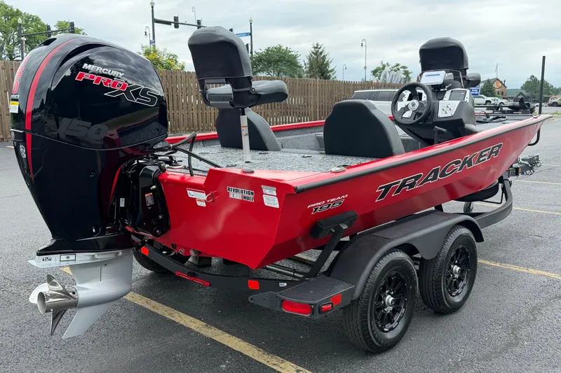 Slide: The Image of 2026 Tracker Pro Team 195 boat with Mercury Pro XS engine, parked on a trailer. - 5