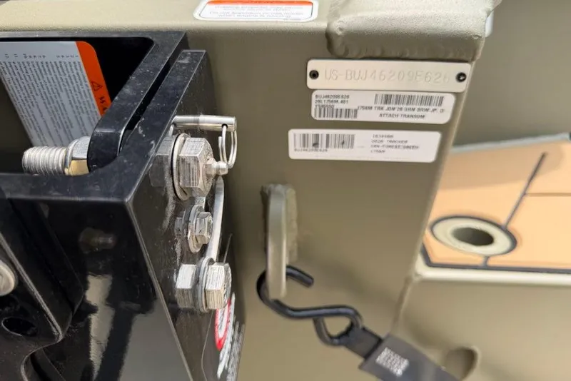 Slide: The Image of Close-up of 2026 Tracker Grizzly 1756 T Marsh boat identification and hardware details. - 17