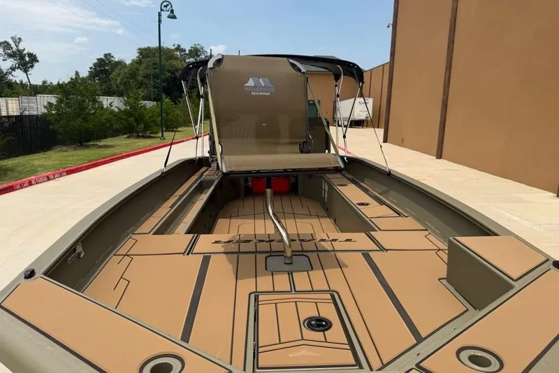 Slide: The Image of 2026 Tracker Grizzly 1756 T Marsh boat with spacious deck and canopy in outdoor setting. - 3