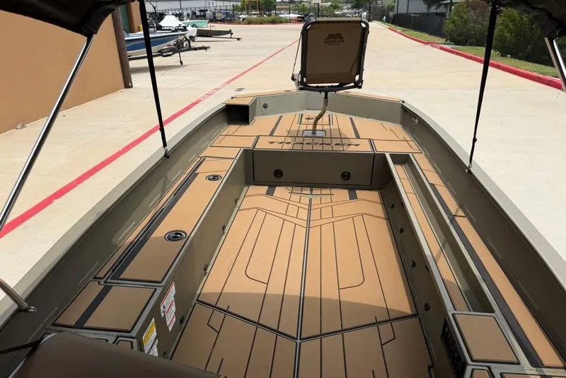 Slide: The Image of 2026 Tracker Grizzly 1756 T Marsh boat interior with spacious deck and seating. - 8