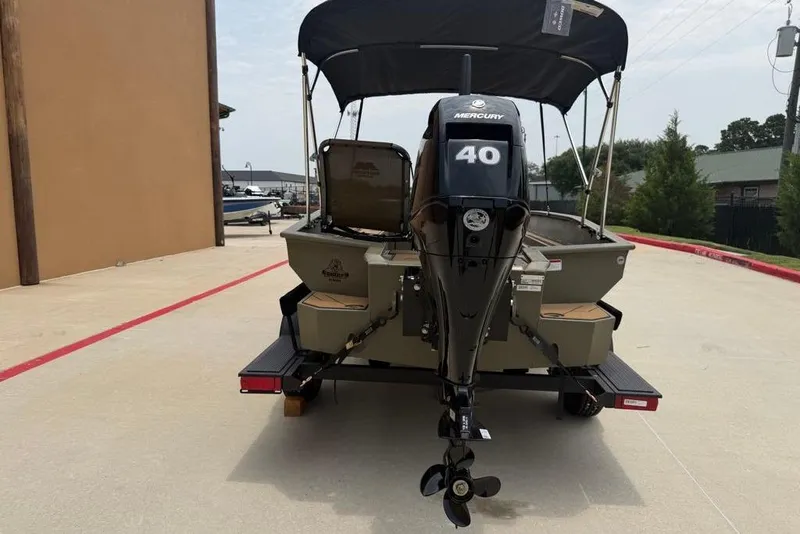 Slide: The Image of 2026 Tracker Grizzly 1756 T Marsh boat with Mercury 40 engine, parked outdoors. - 9