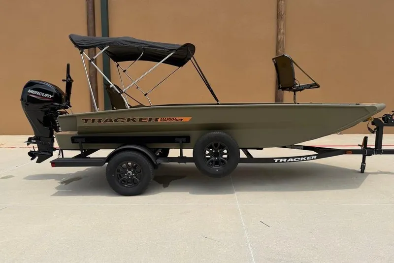 Slide: The Image of 2026 Tracker Grizzly 1756 T Marsh boat on trailer with Mercury outboard motor. - 5
