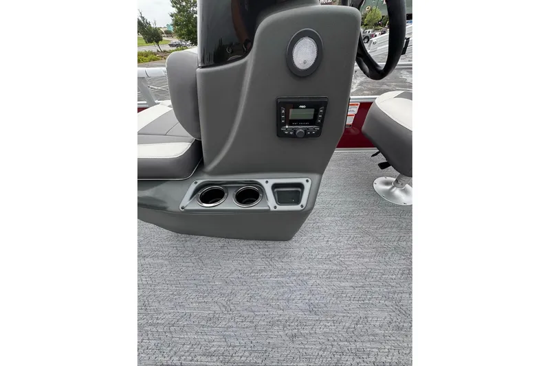 Slide: The Image of 2026 Sun Tracker Bass Buggy 16 XL Select boat console with cup holders and controls. - 10