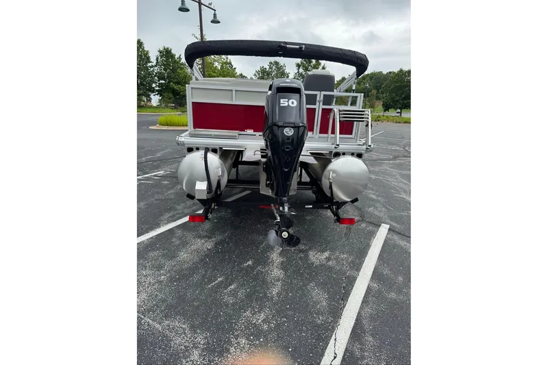 Slide: The Image of 2026 Sun Tracker Bass Buggy 16 XL Select pontoon boat with 50 HP outboard motor. - 6