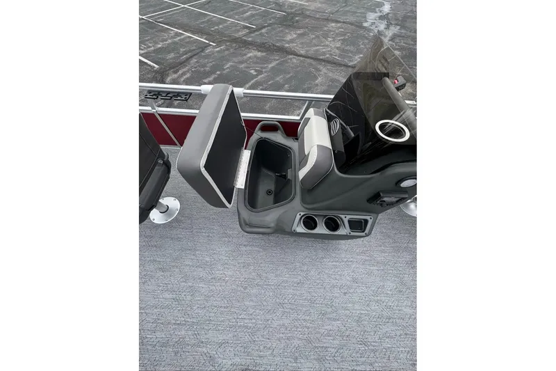 Slide: The Image of 2026 Sun Tracker Bass Buggy 16 XL Select boat interior with open storage compartment and seating. - 7