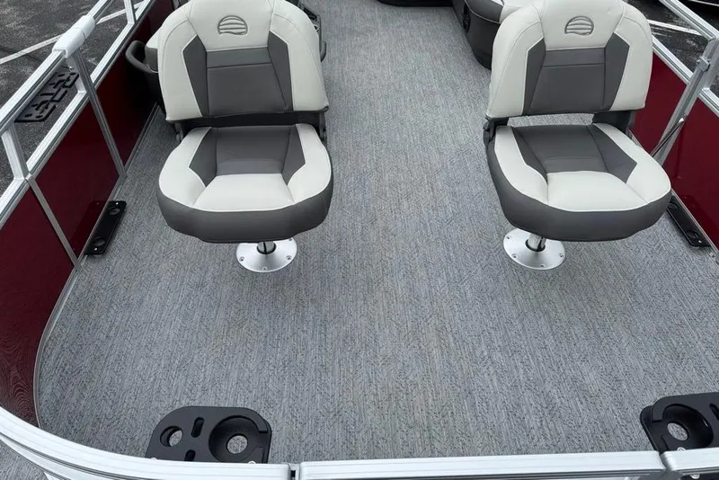 Slide: The Image of 2026 Sun Tracker Bass Buggy 16 XL Select interior with swivel seats and carpeted flooring. - 8