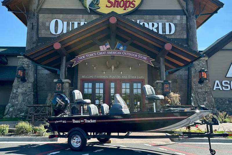 The Image of 2026 Tracker Bass Tracker Classic XL boat displayed outside outdoor store. - 0
