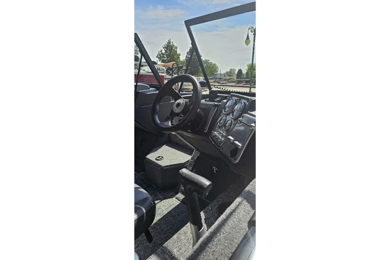 Slide: The Image of Interior view of 2026 Tracker Pro Guide V-175 Combo boat cockpit with steering wheel and gauges. - 15