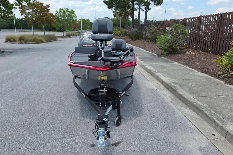 Slide: The Image of 2026 Tracker Bass Tracker Classic XL boat on trailer, parked on a street. - 10