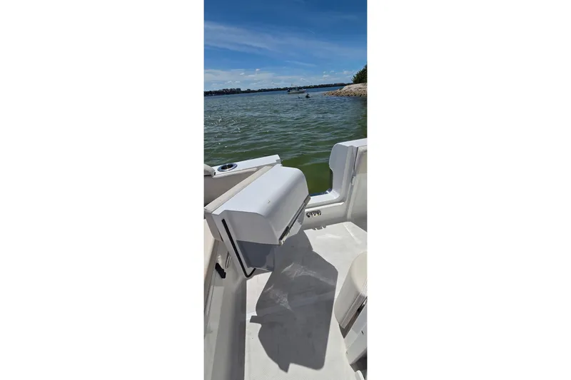 Slide: The Image of 2021 Sea Hunt Escape 27 boat interior with scenic water view. - 13