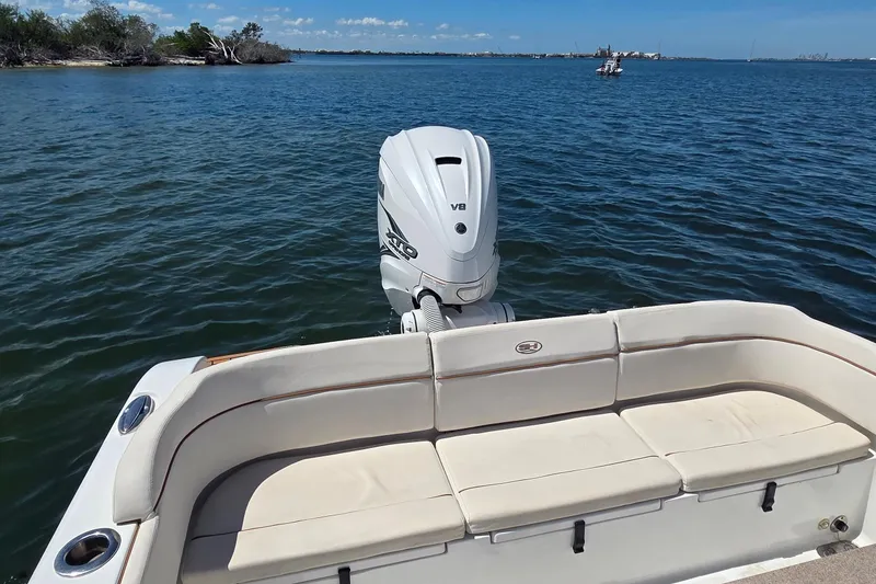 Slide: The Image of 2021 Sea Hunt Escape 27 boat with V8 engine on calm water. - 20