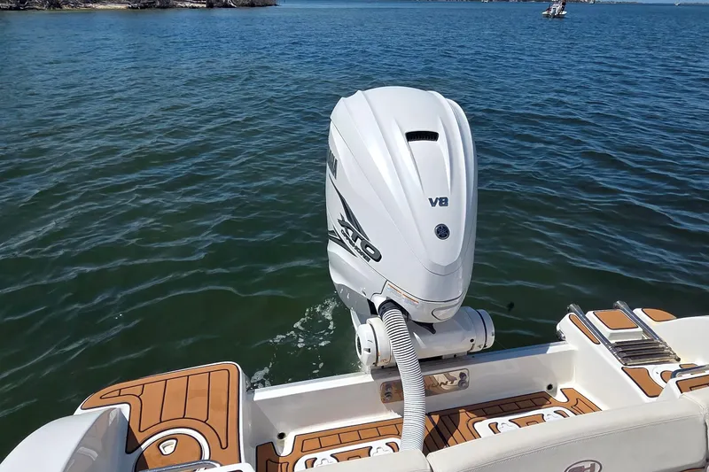 Slide: The Image of 2021 Sea Hunt Escape 27 boat with Yamaha V8 engine on water. - 21