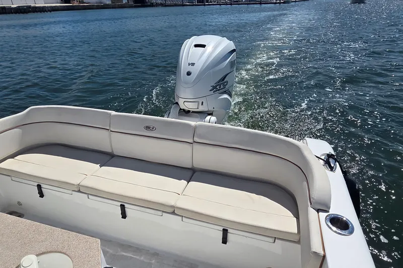 Slide: The Image of 2021 Sea Hunt Escape 27 boat with Yamaha V8 engine on water. - 4