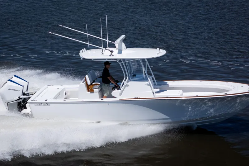 Slide: The Image of 2027 Valhalla Boatworks V-29 Hybrid cruising on water, showcasing sleek design and powerful engine. - 12