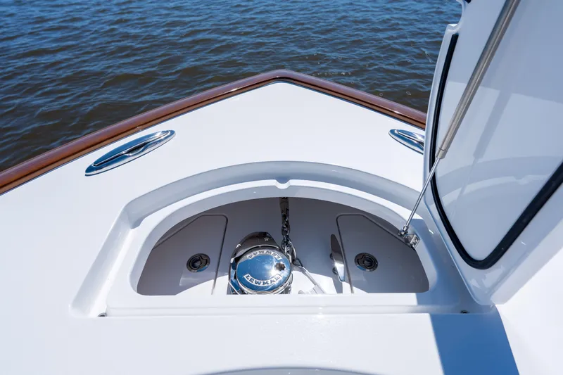 Slide: The Image of 2027 Valhalla Boatworks V-29 Hybrid anchor compartment, open on calm water. - 14