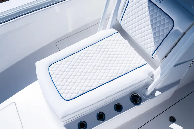 Slide: The Image of Luxurious seating on 2027 Valhalla Boatworks V-29 Hybrid with diamond-pattern upholstery. - 17