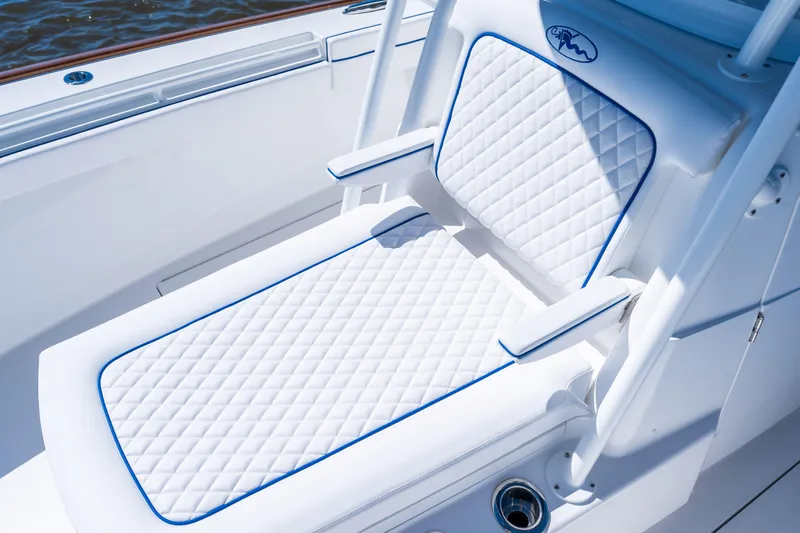 Slide: The Image of Luxurious seating on 2027 Valhalla Boatworks V-29 Hybrid, featuring quilted white upholstery. - 19