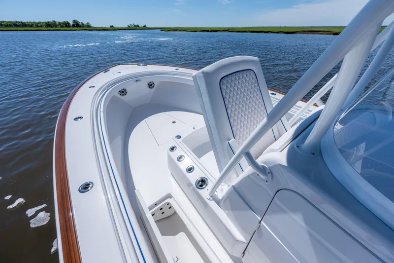 Slide: The Image of 2027 Valhalla Boatworks V-29 Hybrid on calm water, showcasing sleek design and spacious deck. - 23