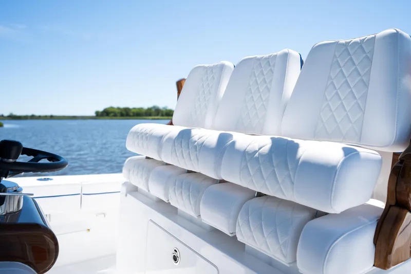 Slide: The Image of Luxurious seating on 2027 Valhalla Boatworks V-29 Hybrid, with scenic water backdrop. - 26