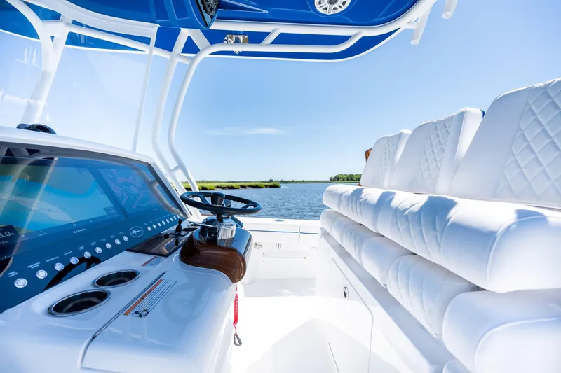 Slide: The Image of 2027 Valhalla Boatworks V-29 Hybrid interior with white seating and advanced navigation system. - 27