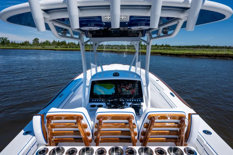 Slide: The Image of 2027 Valhalla Boatworks V-29 Hybrid, sleek design, advanced navigation, cruising on calm waters. - 30