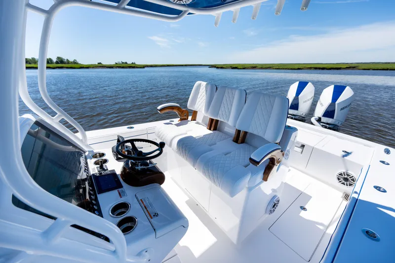 Slide: The Image of 2027 Valhalla Boatworks V-29 Hybrid interior with luxurious seating and dual outboard engines. - 32