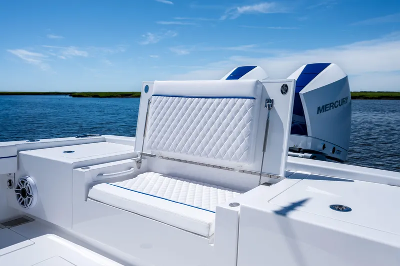 Slide: The Image of 2027 Valhalla Boatworks V-29 Hybrid with luxurious seating and Mercury engines on a serene water backdrop. - 38