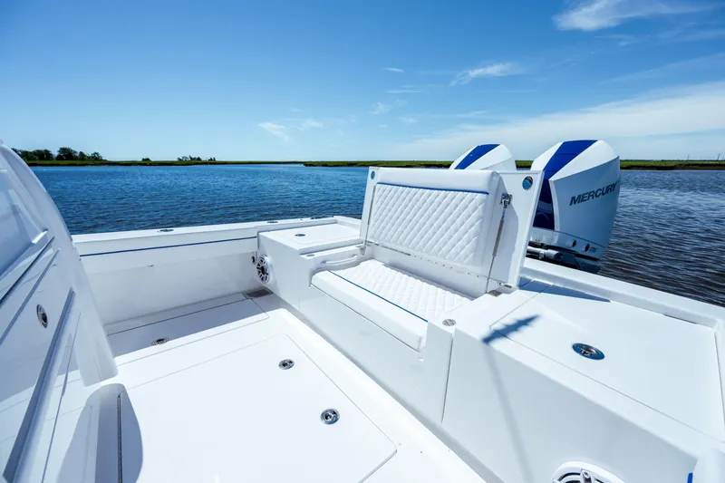Slide: The Image of 2027 Valhalla Boatworks V-29 Hybrid, featuring sleek seating and dual Mercury engines on calm waters. - 39